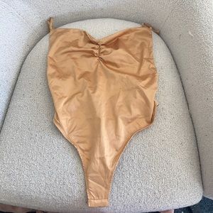 Gold silk free people body suit never worn NWT